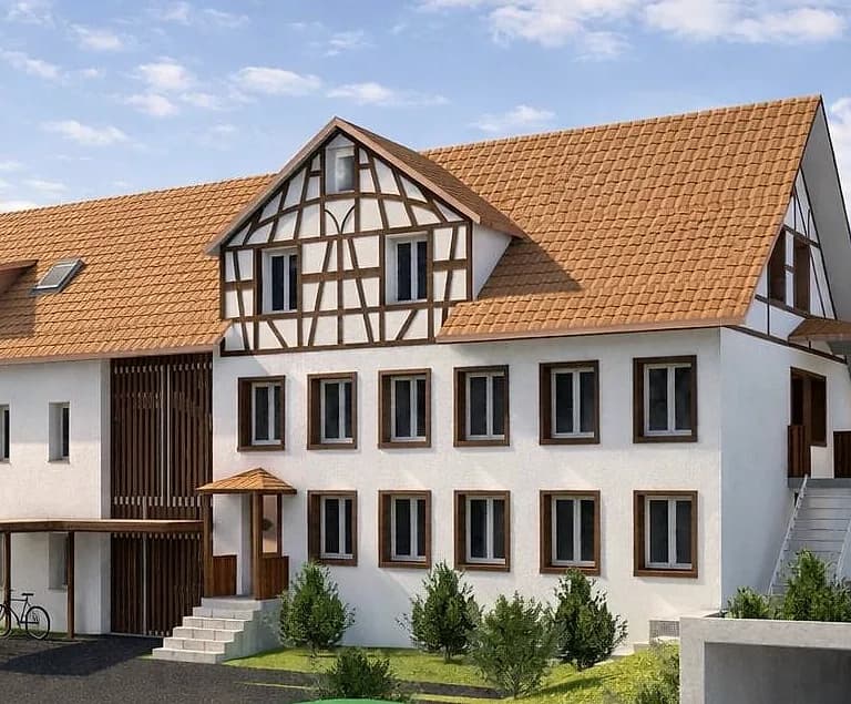 Eingang und Riegelfassade des Bestands